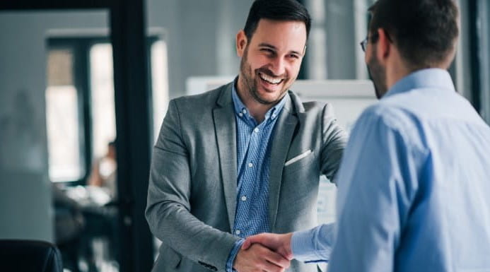 Image of two men shaking hands