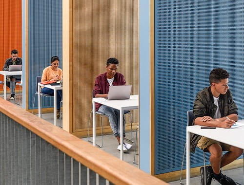 row of students in study area exams cubicles