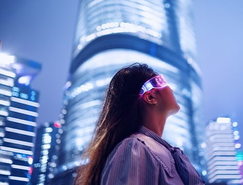 Young businesswoman standing against contemporary financial skyscrapers in the downtown financial district