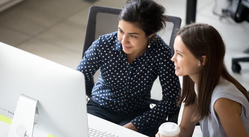 Two women studying