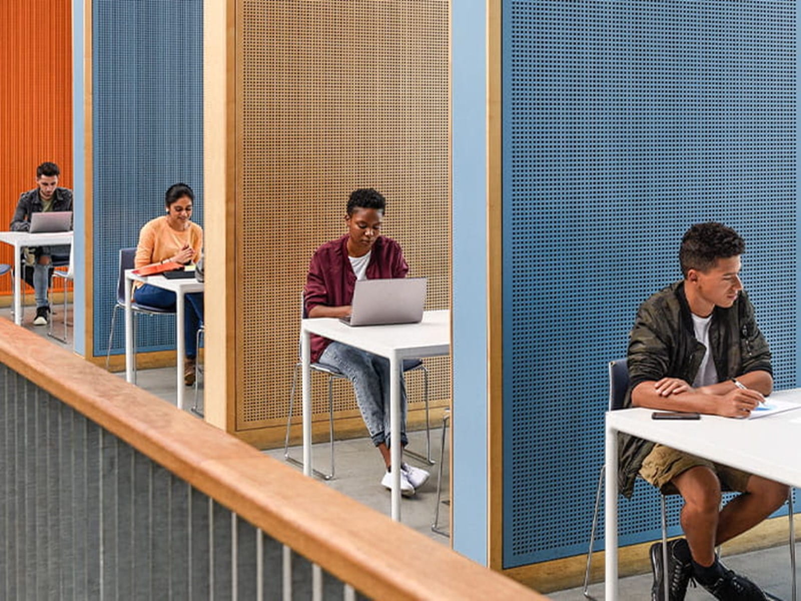 row of students in study area exams cubicles