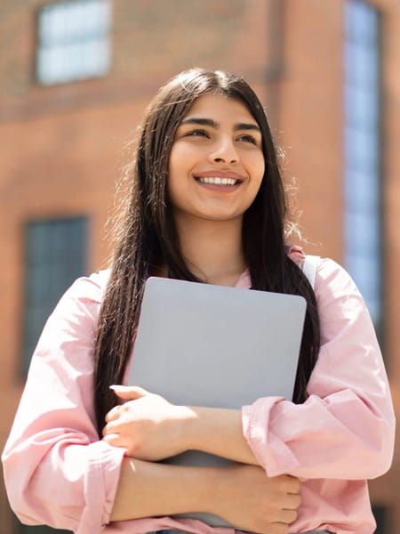 Girl holding laptop