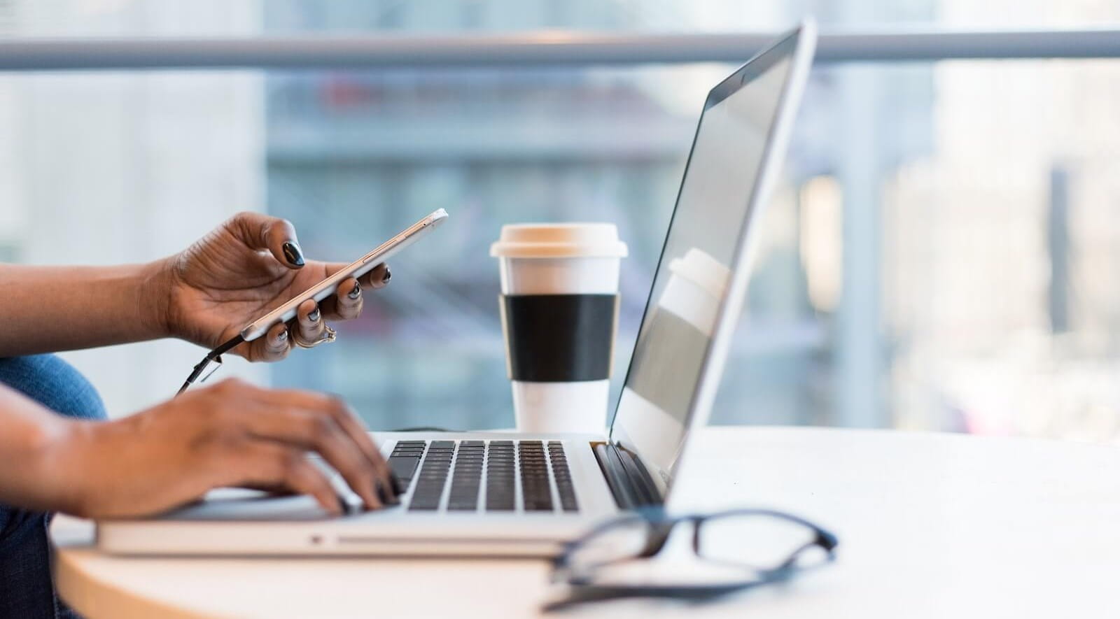 Laptop, phone and coffee cup