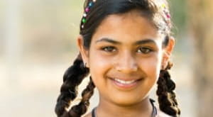 Young smiling girl in yellow top