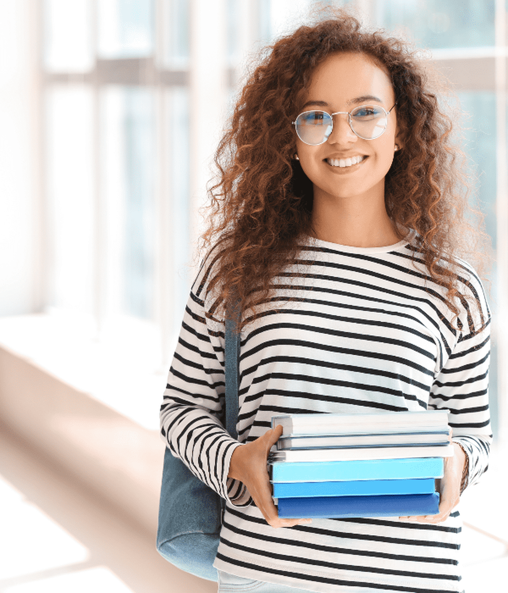 Student holding books.