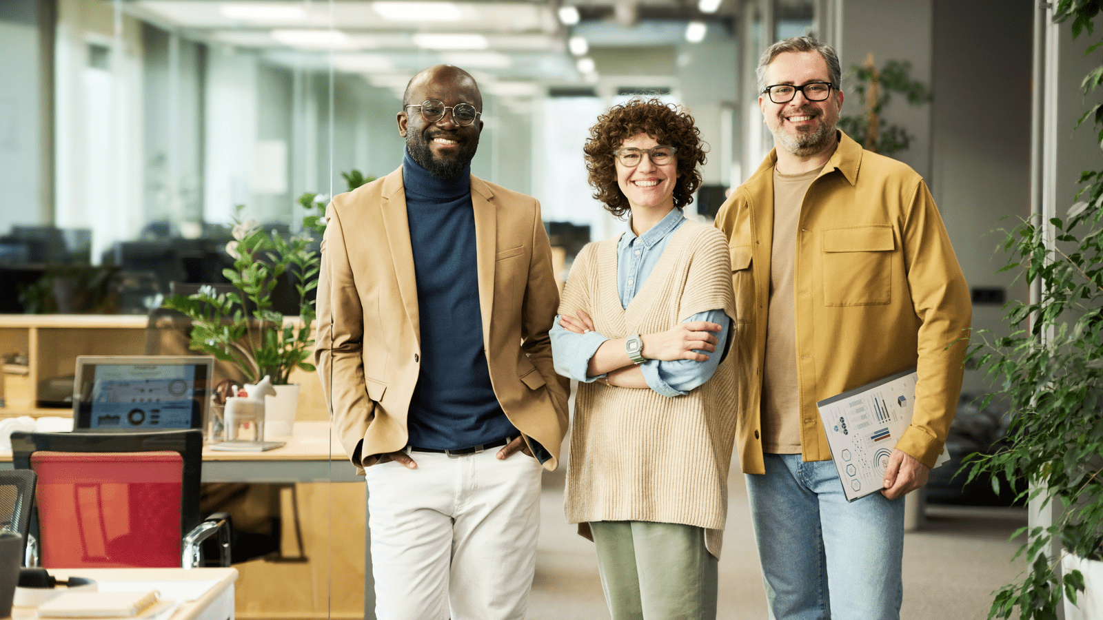 people standing in office smiling