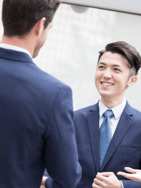 Young men shaking hands