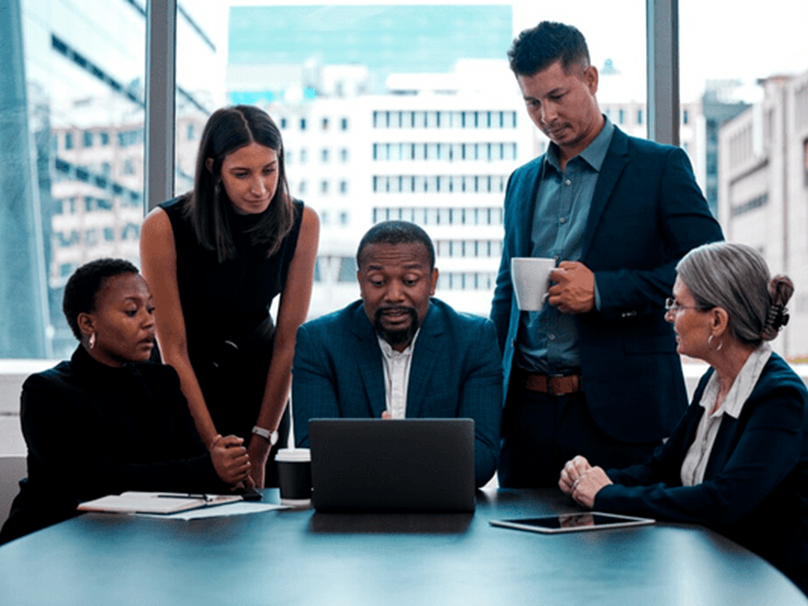 People looking at laptop