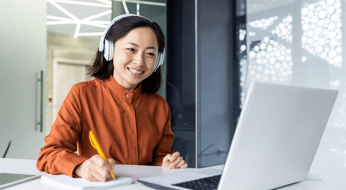 Smiling woman on laptop video meeting Smiling woman on laptop video meeting