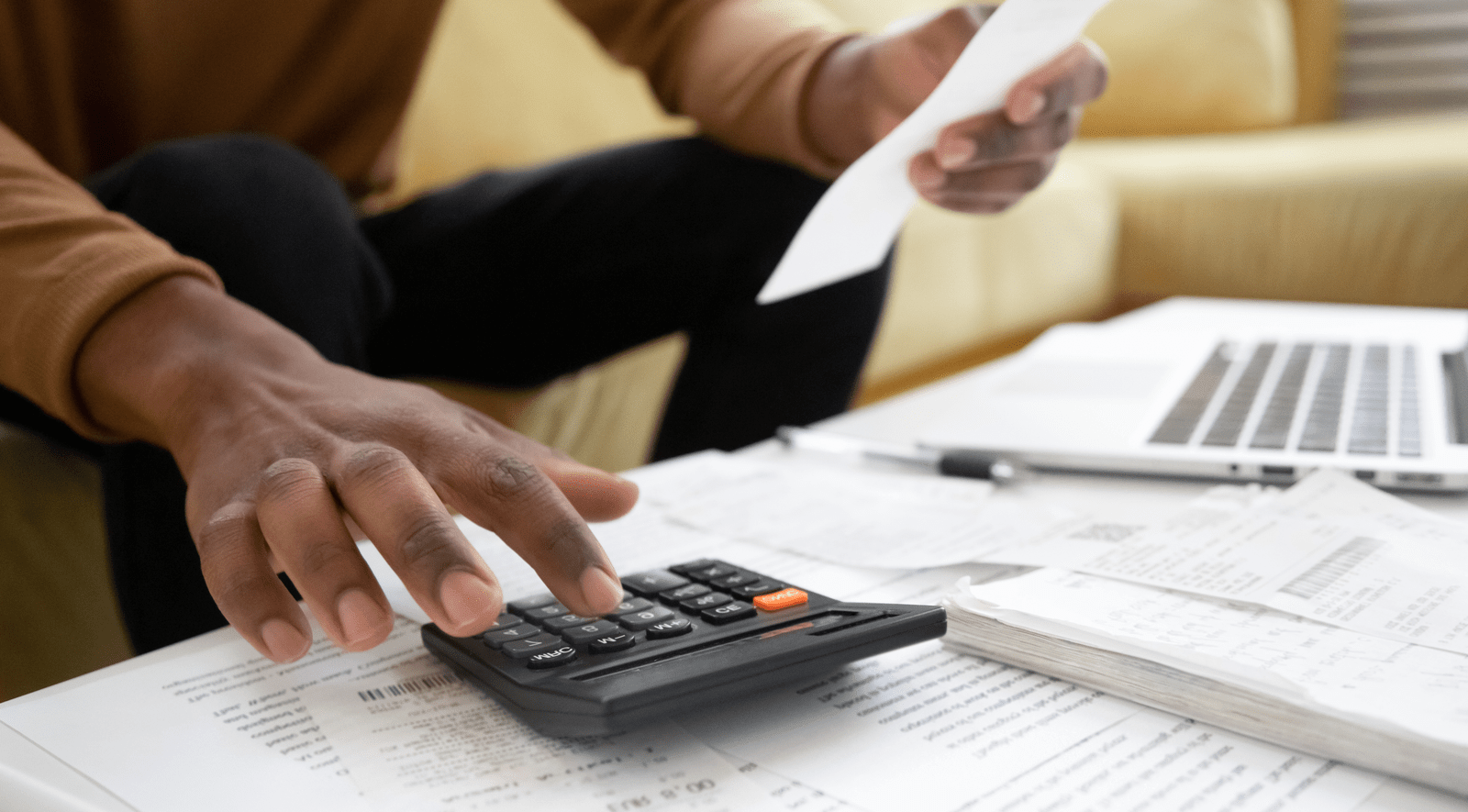 Man working with a calculator